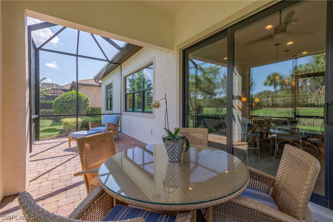 20198 Corkscrew Shores Boulevard Estero, FL 33928 - Photo 26 of 50 a living room with fireplace furniture and a large window