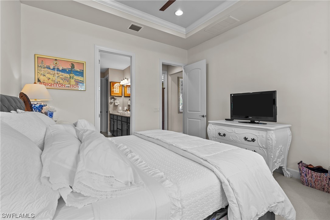 20198 Corkscrew Shores Boulevard Estero, FL 33928 - Photo 3 of 50 a bedroom with a bed and a flat screen tv