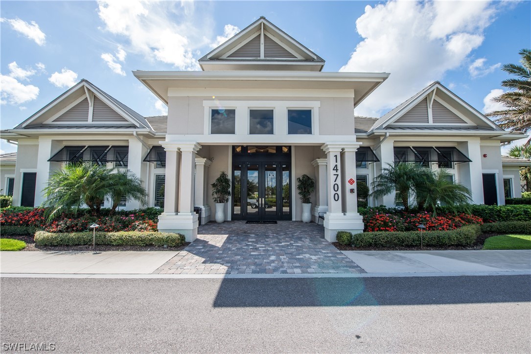 20198 Corkscrew Shores Boulevard Estero, FL 33928 - Photo 42 of 50 a front view of a house with a yard