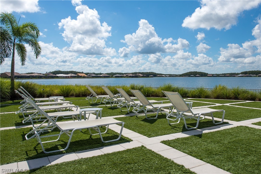 20198 Corkscrew Shores Boulevard Estero, FL 33928 - Photo 46 of 50 a view of a lake with lawn chairs