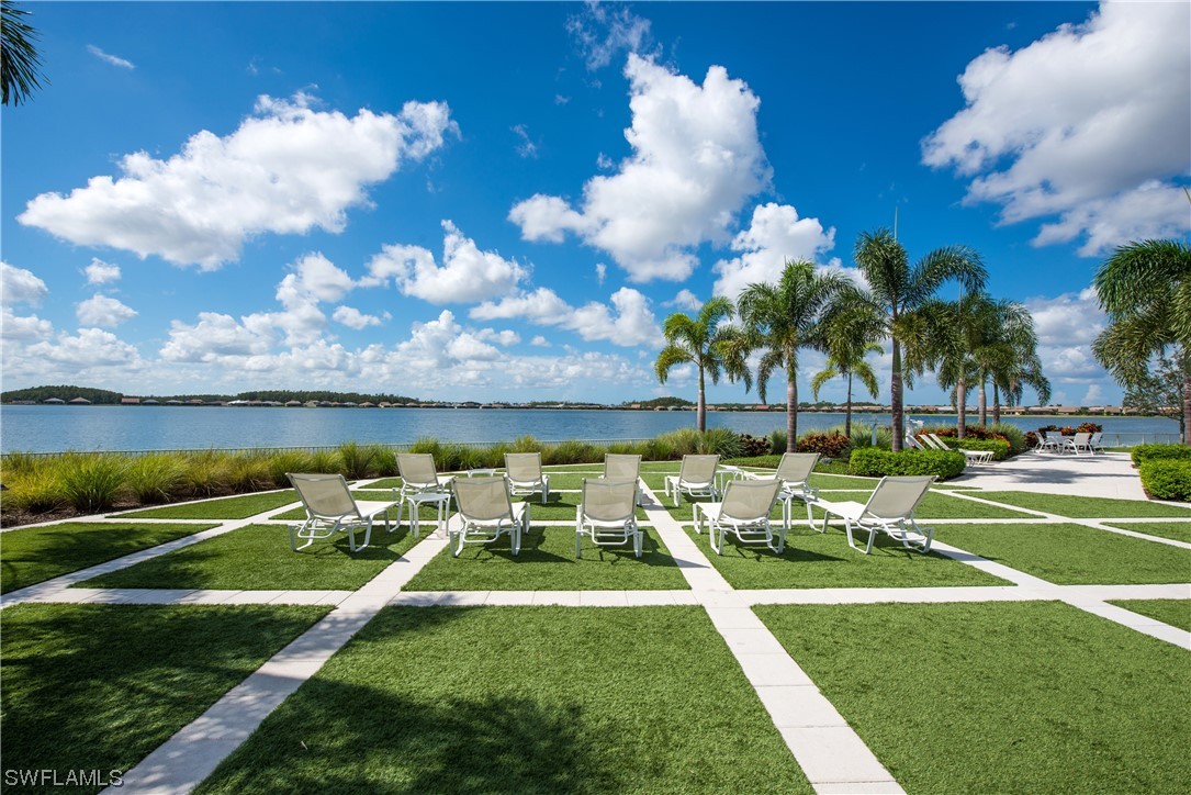 20198 Corkscrew Shores Boulevard Estero, FL 33928 - Photo 47 of 50 a swimming pool with outdoor seating and yard