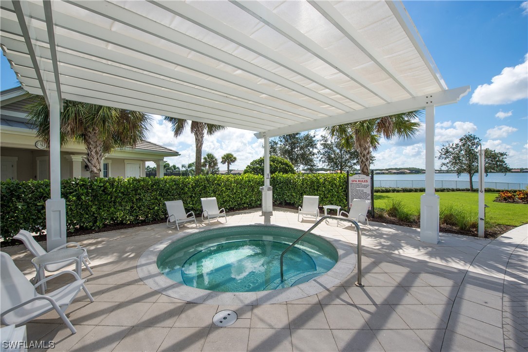 20198 Corkscrew Shores Boulevard Estero, FL 33928 - Photo 49 of 50 a swimming pool with outdoor seating and yard