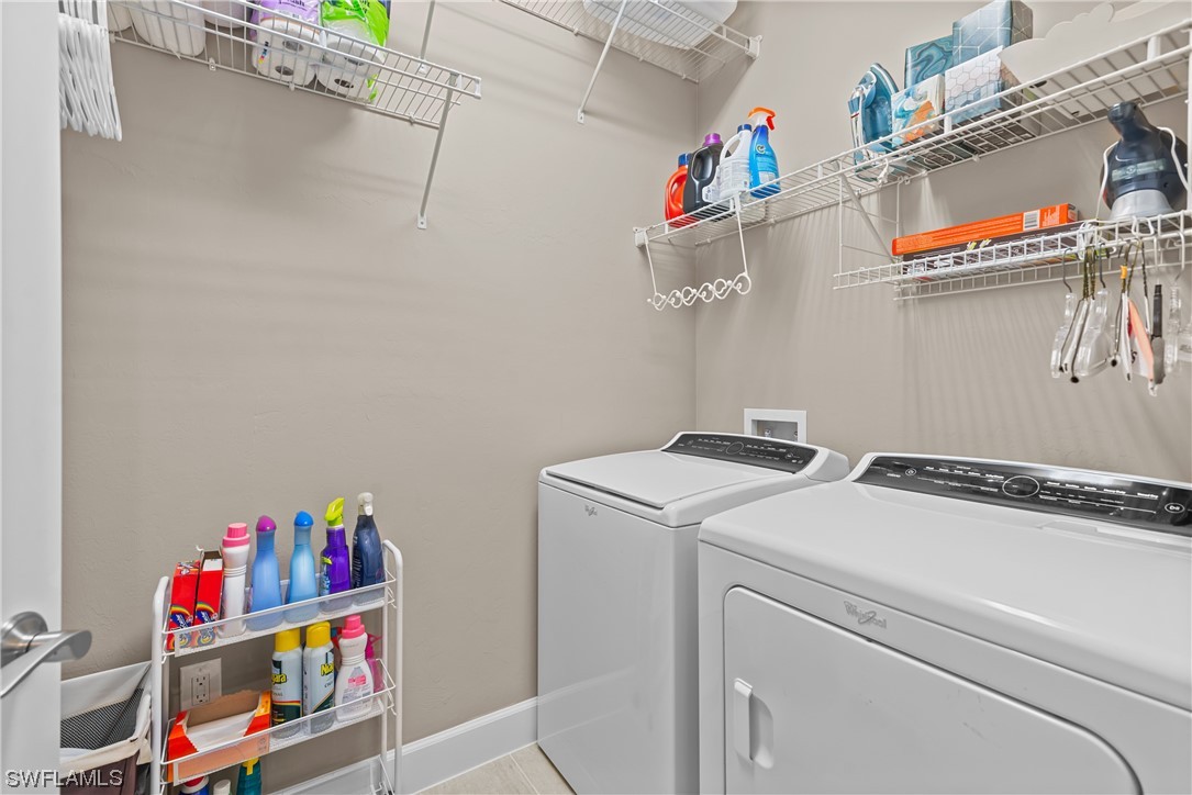 20198 Corkscrew Shores Boulevard Estero, FL 33928 - Photo 6 of 50 a utility room with dryer and washer