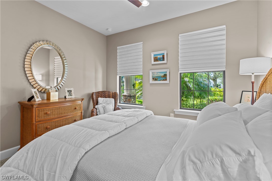 20198 Corkscrew Shores Boulevard Estero, FL 33928 - Photo 10 of 50 a bedroom with a bed and a dresser