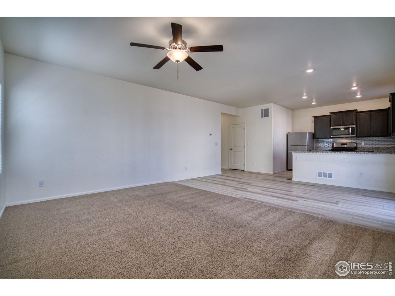7015 Fall River Drive Frederick, CO 80530 - Photo 12 of 34 a view of a kitchen with a sink and cabinets