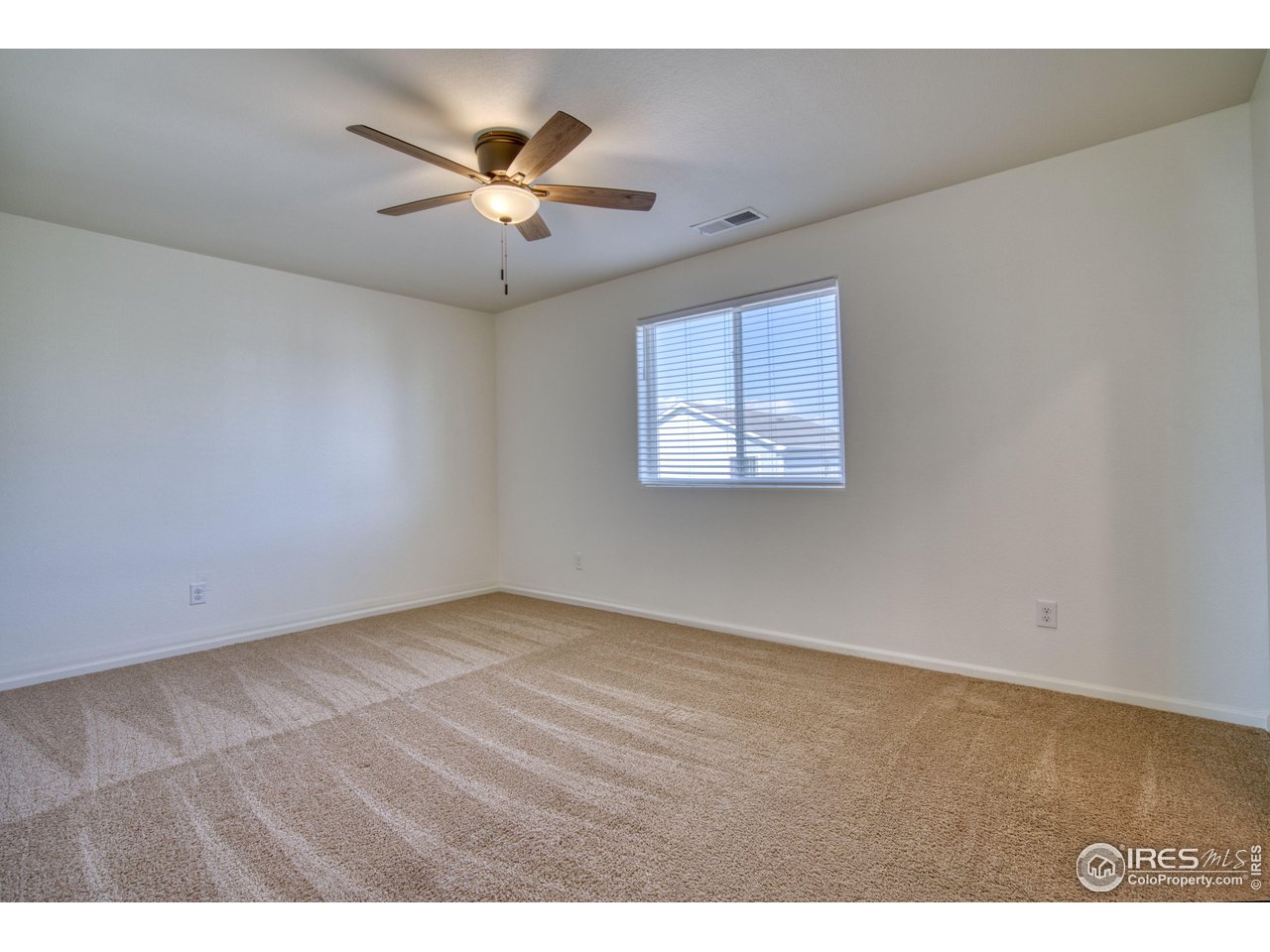 7015 Fall River Drive Frederick, CO 80530 - Photo 17 of 34 a view of an empty room