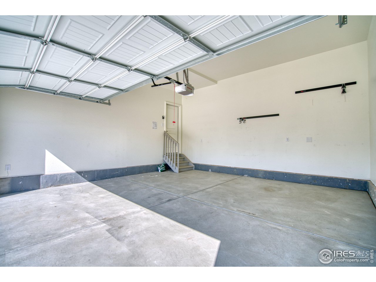7015 Fall River Drive Frederick, CO 80530 - Photo 31 of 34 a view of a room with rack on the wall