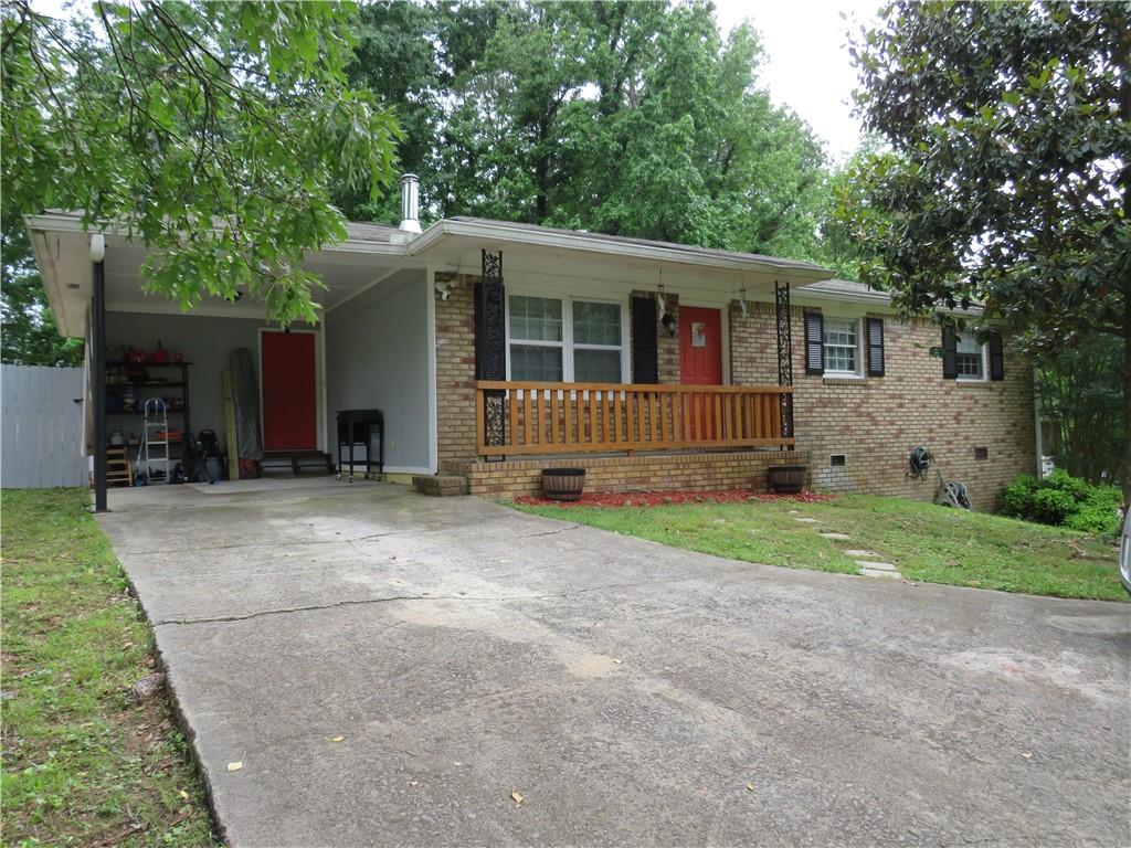 1441 Stringer Road Rockmart, GA 30153 - Photo 1 of 1 a front view of house with yard and porch