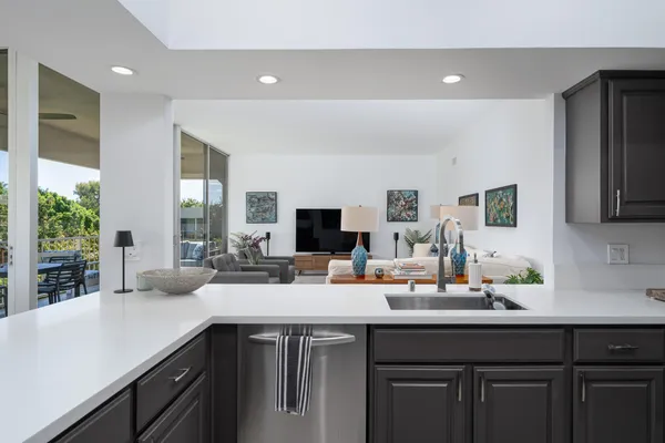 a kitchen with a sink and cabinets