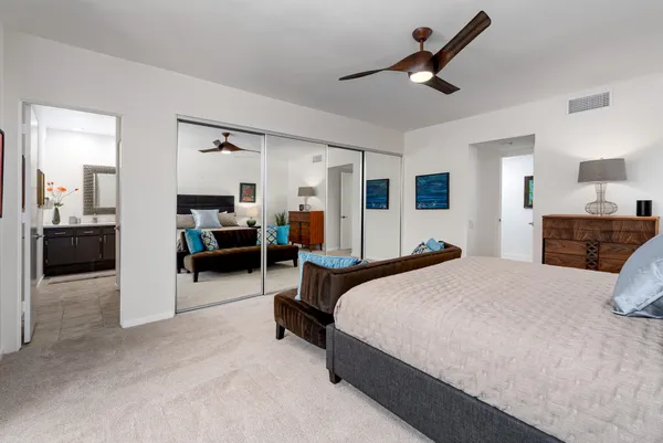 a bedroom with bed and window