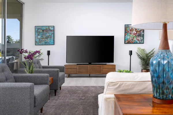 a living room with furniture and a flat screen tv