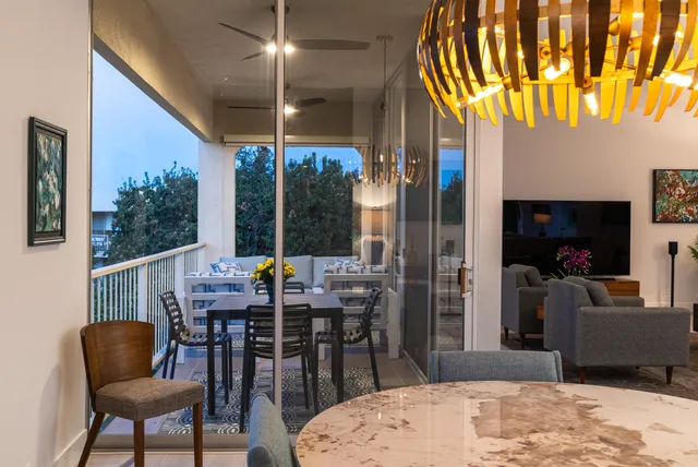 a view of a dining room with furniture window and outside view
