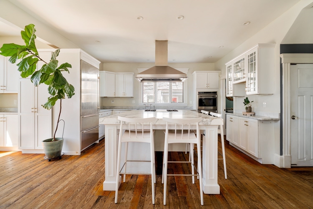 70 Oxford Street Somerville, MA 02143 - Photo 2 of 38 a view of a kitchen with furniture and wooden floor