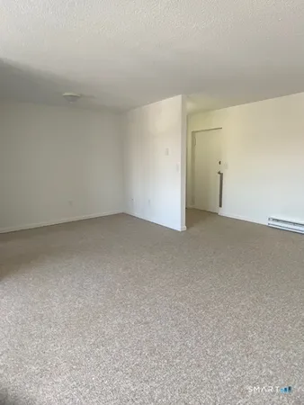 an empty room with white cabinet