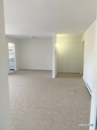 a view of a hallway with two bathroom