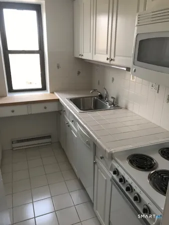 a view of parking garage with cars