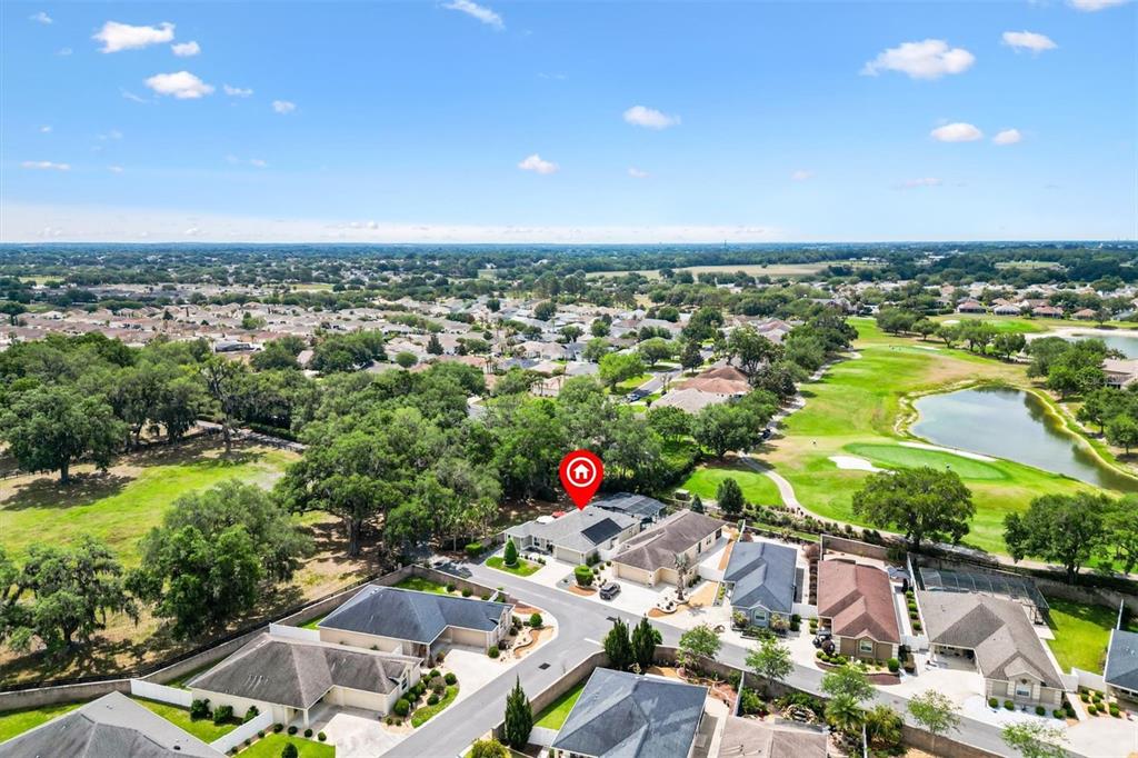 7351 Southeast 169th Cote Loop The Villages, FL 32162 - Photo 32 of 32 an aerial view of residential houses with outdoor space and swimming pool