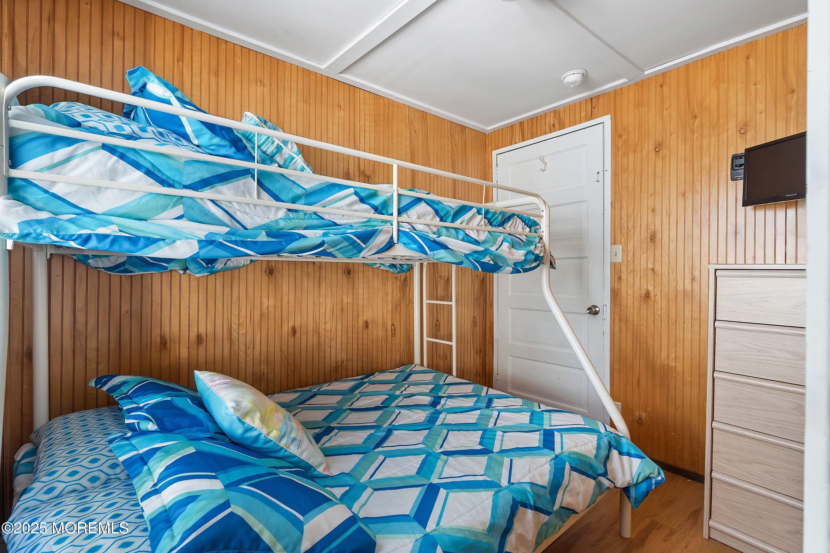 10 Brunswick Place Point Pleasant Beach, NJ 08742 - Photo 19 of 39 a bedroom with a bed and a dresser