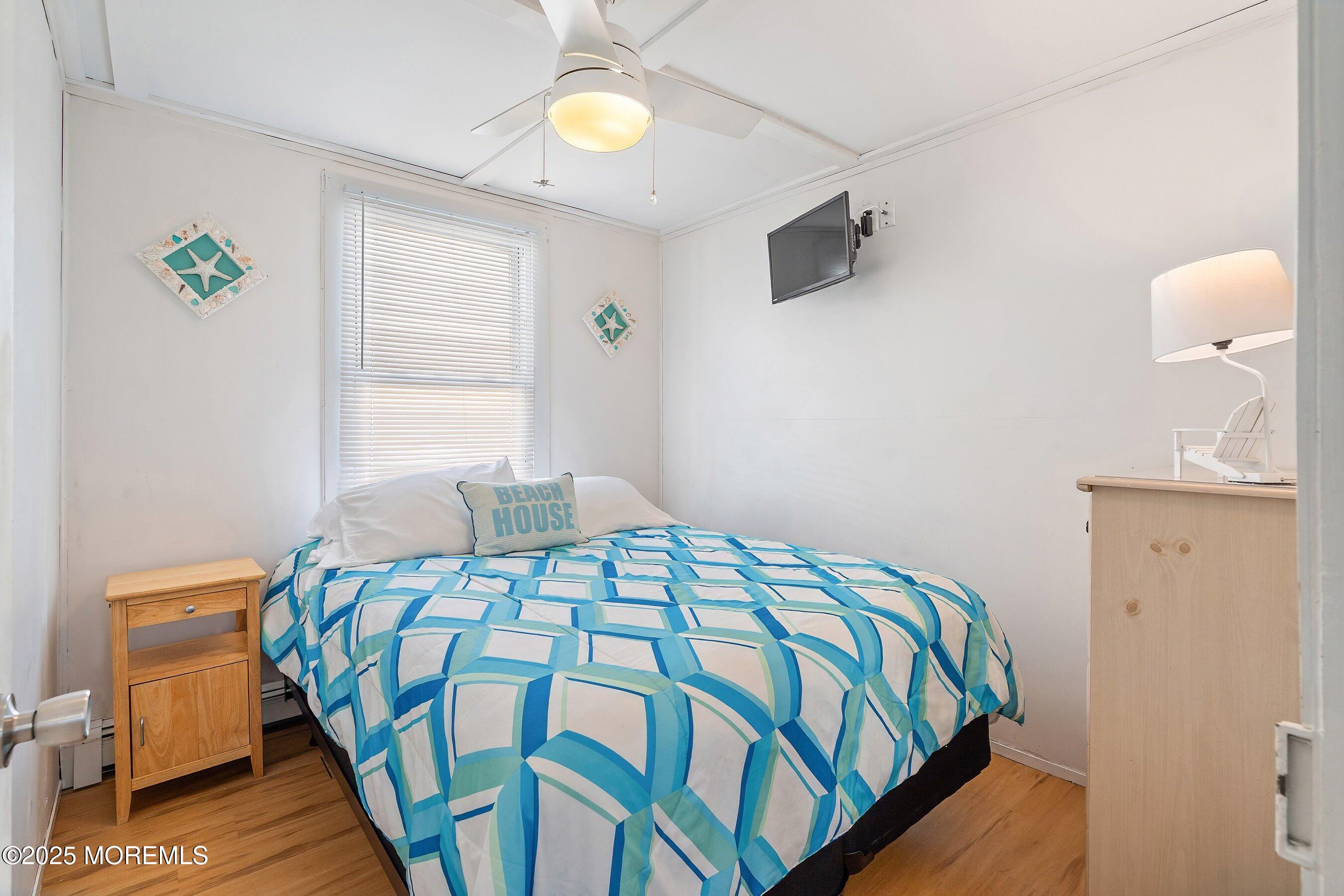 10 Brunswick Place Point Pleasant Beach, NJ 08742 - Photo 20 of 39 a bedroom with a bed and a window