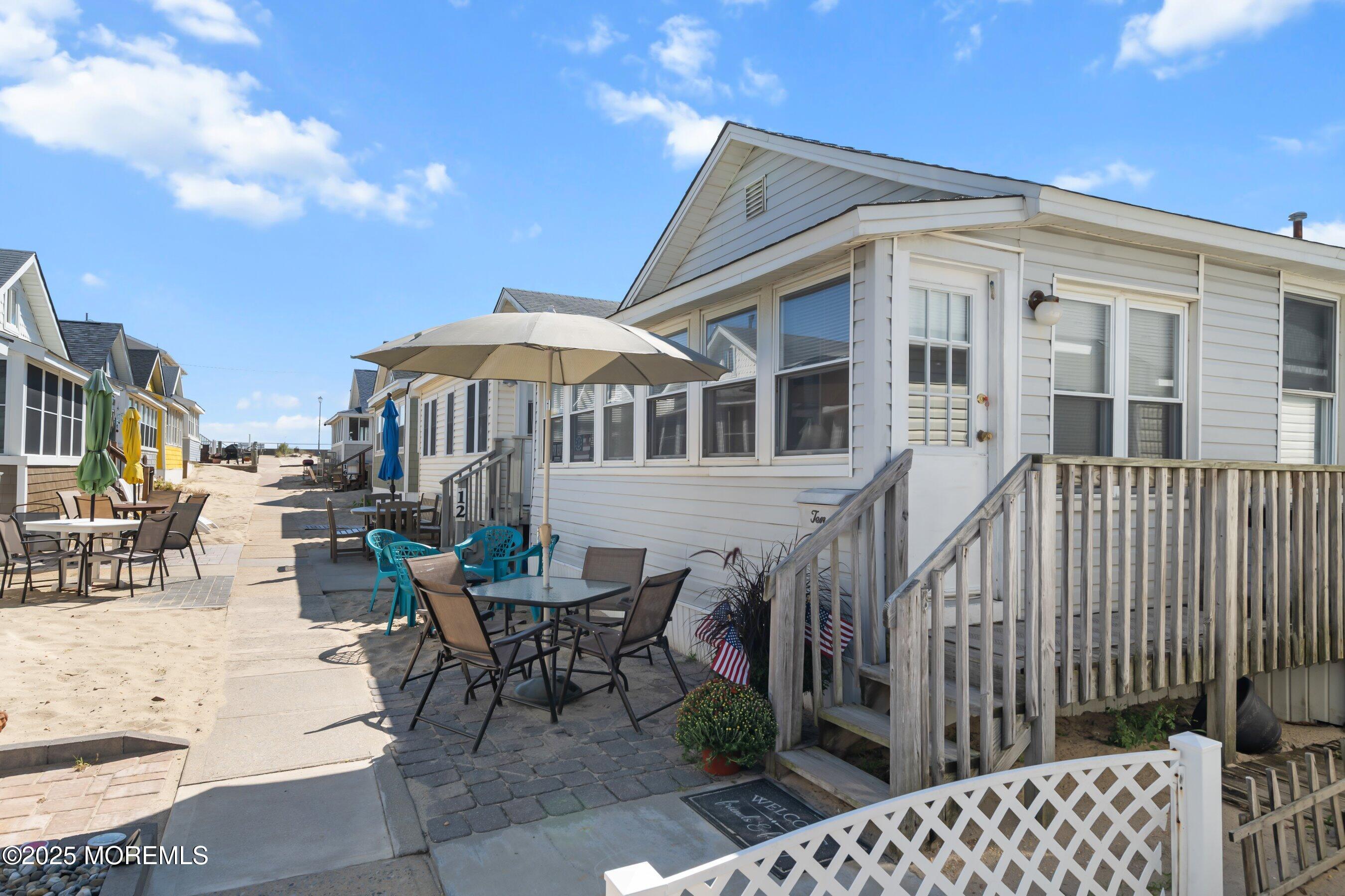 10 Brunswick Place Point Pleasant Beach, NJ 08742 - Photo 8 of 39 a view of a house with backyard and sitting area