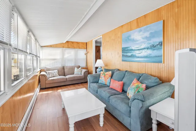 a kitchen with stainless steel appliances a white cabinets and a refrigerator