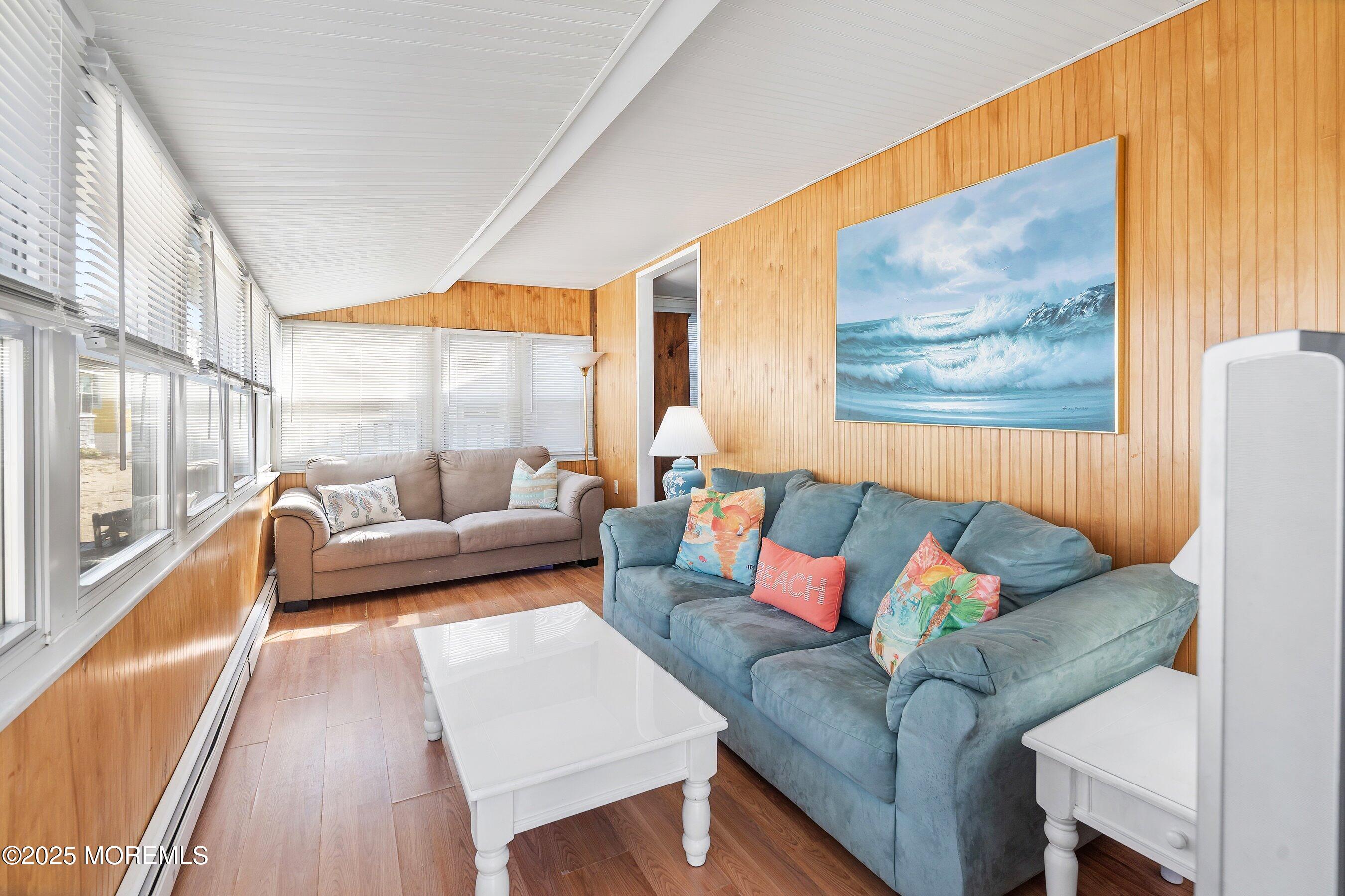 10 Brunswick Place Point Pleasant Beach, NJ 08742 - Photo 10 of 39 a living room with furniture and a large window with outer view