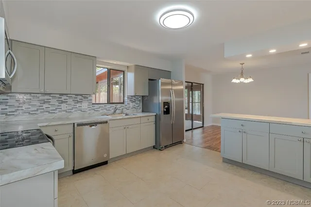 a large kitchen with cabinets