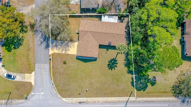 an aerial view of a house with a garden