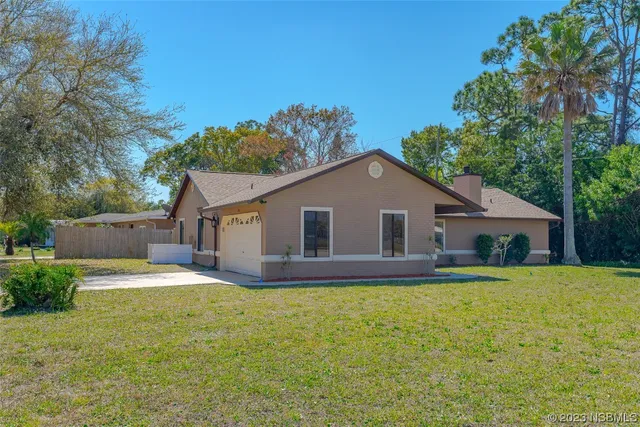 a house with trees in the background