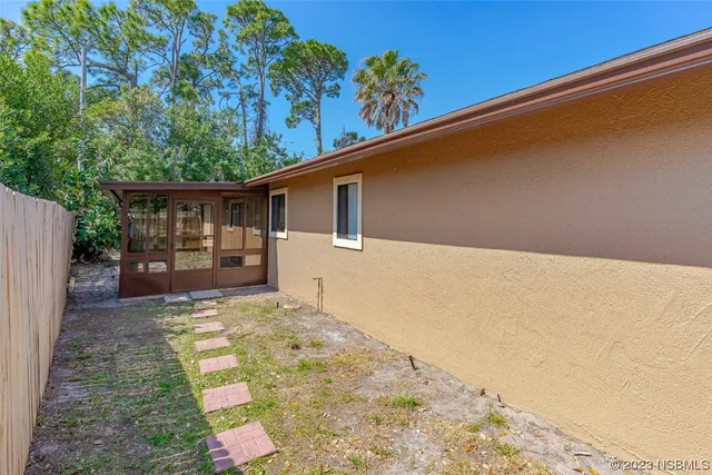 a backyard of a house with seating space