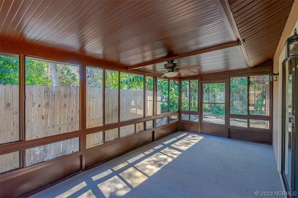 a view of an empty room with windows