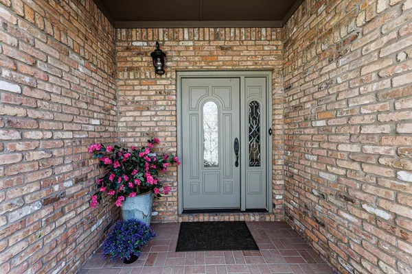 a view of a entryway door front of a house