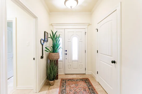 a view of entryway with wooden floor