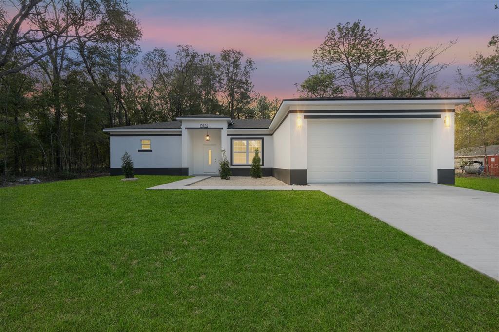 12248 Southwest 96th Lane Dunnellon, FL 34432 - Photo 1 of 26 a view of a backyard with a garden