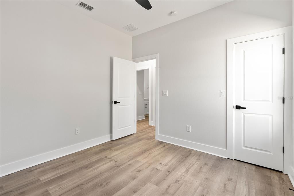 12248 Southwest 96th Lane Dunnellon, FL 34432 - Photo 16 of 26 an empty room with wooden floor