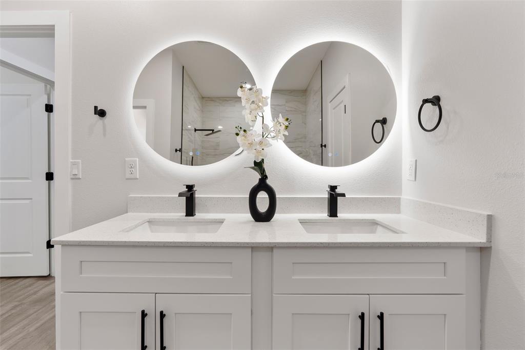 12248 Southwest 96th Lane Dunnellon, FL 34432 - Photo 24 of 26 a bathroom with double vanity sinks and a mirror