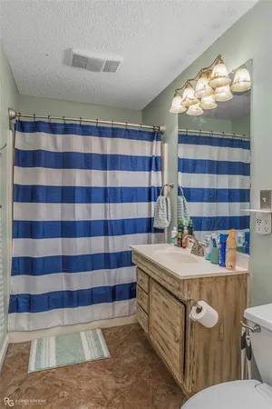 a kitchen with sink stove and cabinets