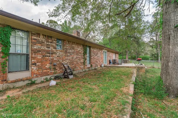 a bedroom with a bed and a ceiling fan