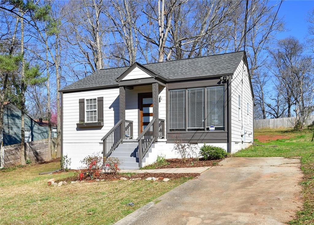1930 Lomita Road Southeast Atlanta, GA 30316 - Photo 1 of 1 a front view of a house with garden