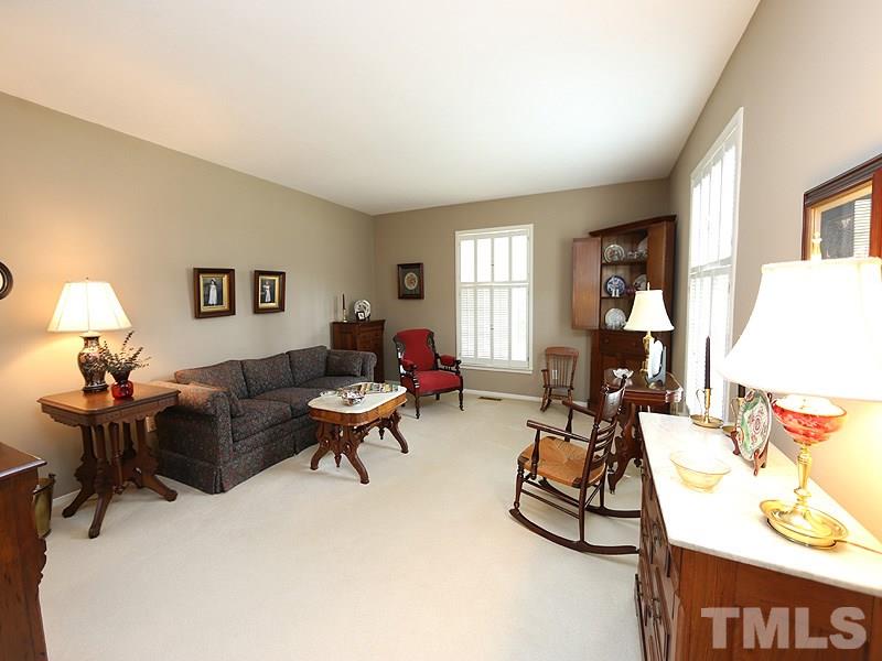 4916 Skidmore Street Raleigh, NC 27609 - Photo 2 of 12 a living room with furniture and a window