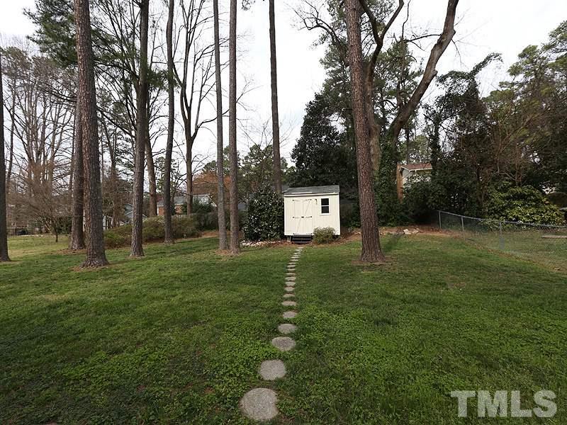 4916 Skidmore Street Raleigh, NC 27609 - Photo 11 of 12 a view of a house with a backyard