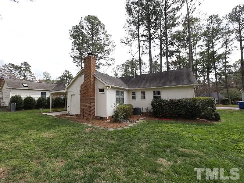 4916 Skidmore Street Raleigh, NC 27609 - Photo 12 of 12 a front view of house with yard and green space