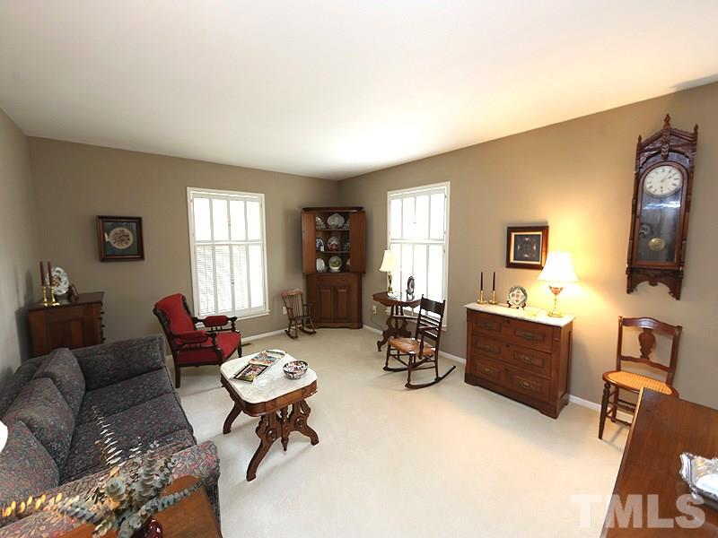 4916 Skidmore Street Raleigh, NC 27609 - Photo 3 of 12 a living room with furniture and a window