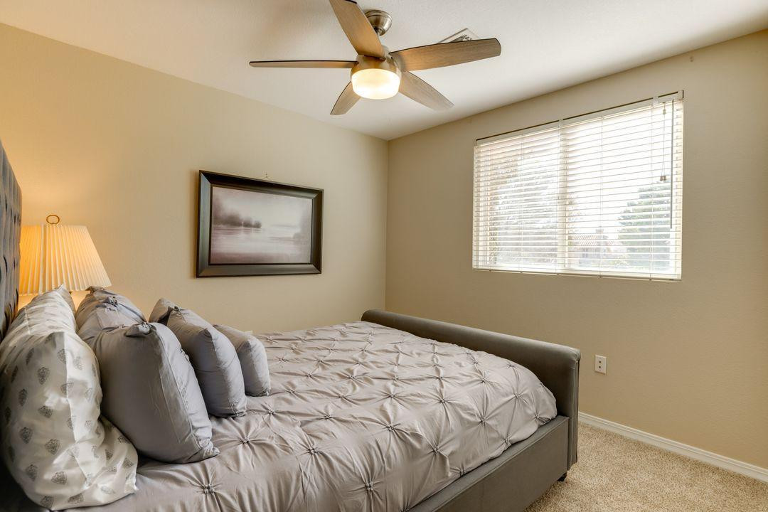 16439 South 34th Way Phoenix, AZ 85048 - Photo 8 of 33 a bedroom with bed and a window