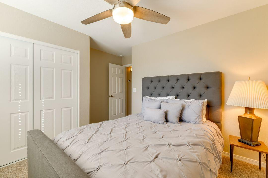 16439 South 34th Way Phoenix, AZ 85048 - Photo 9 of 33 a bedroom with a bed and a lamp