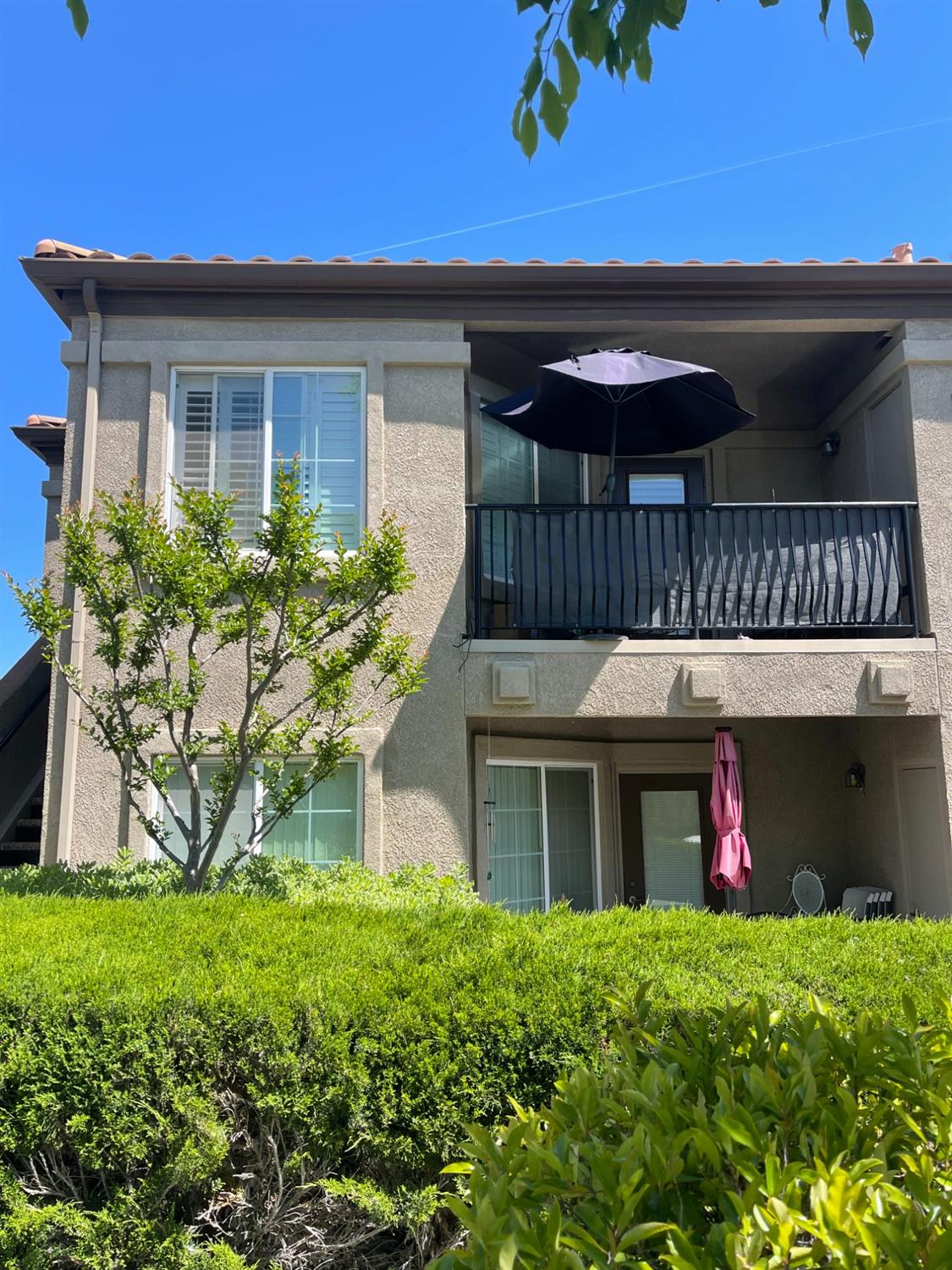4200 East Commerce Way, Unit 2023 Sacramento, CA 95834 - Photo 2 of 12 a front view of a house with garden