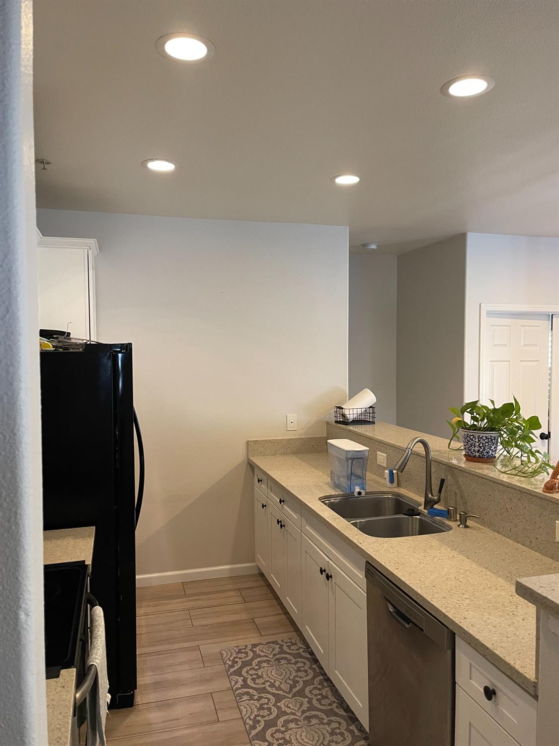 4200 East Commerce Way, Unit 2023 Sacramento, CA 95834 - Photo 4 of 12 a kitchen with a sink and a refrigerator