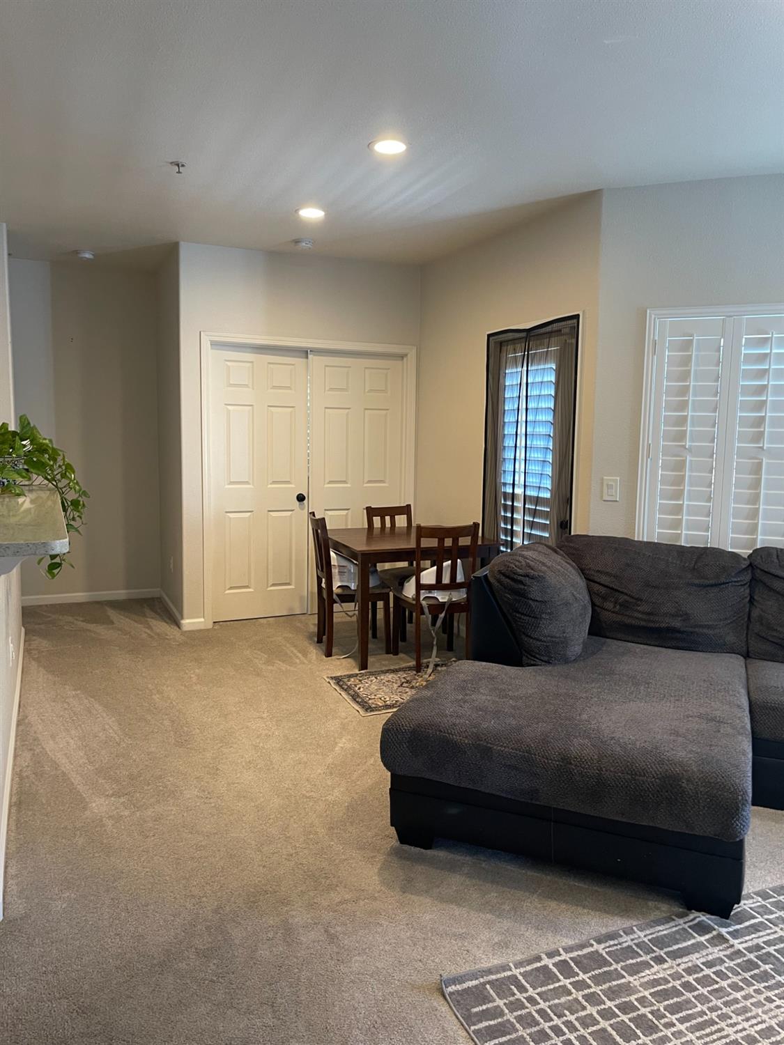 4200 East Commerce Way, Unit 2023 Sacramento, CA 95834 - Photo 5 of 12 a living room with furniture and wooden floor