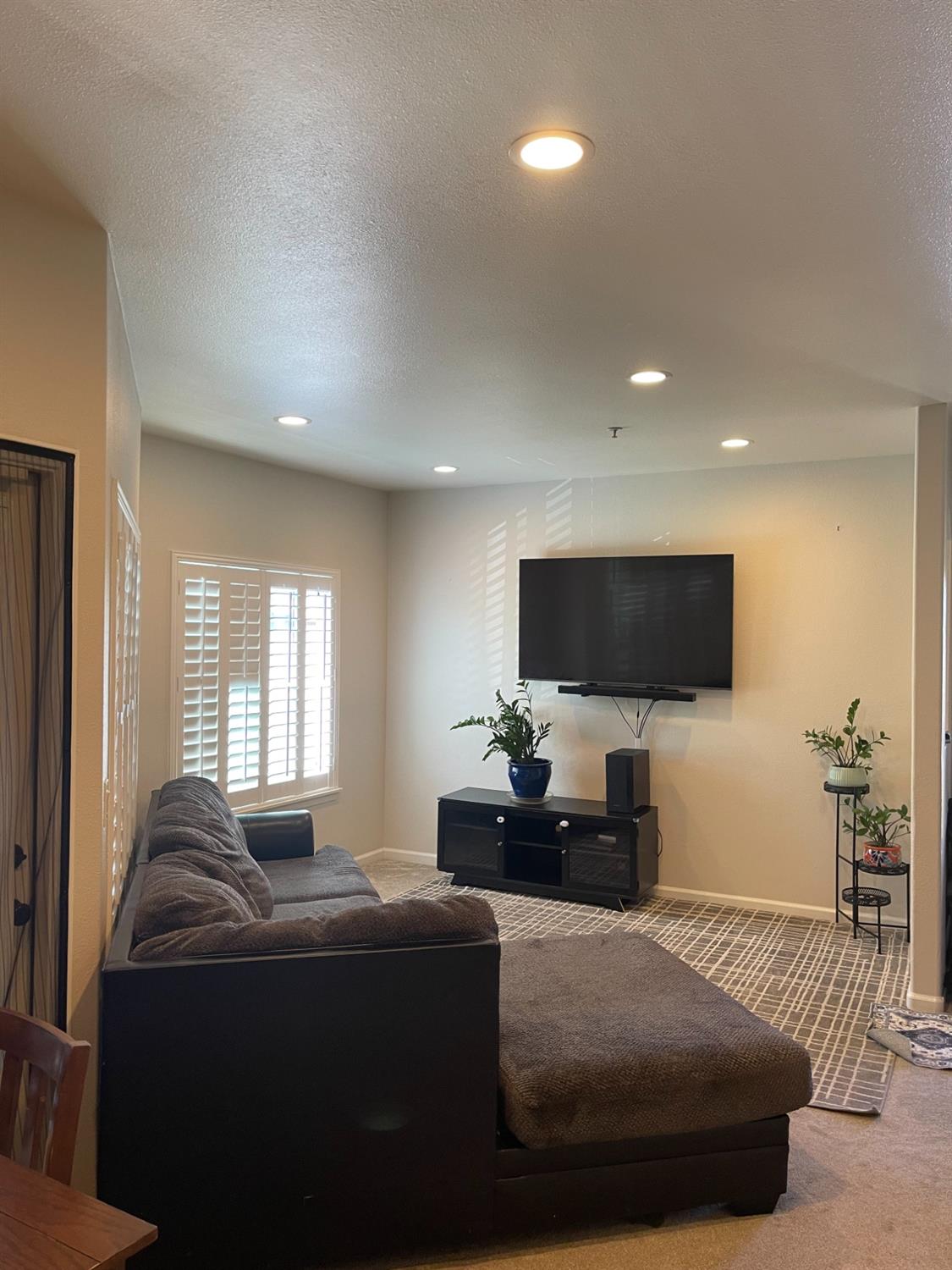 4200 East Commerce Way, Unit 2023 Sacramento, CA 95834 - Photo 6 of 12 a living room with furniture and a flat screen tv