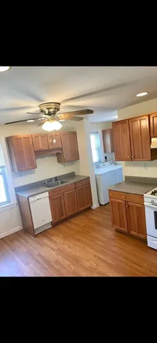 a view of kitchen with wooden floor